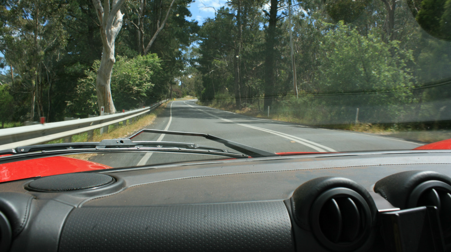 The view from the passenger seat of Chris Burton's Exige, complete with Red Malalla dust